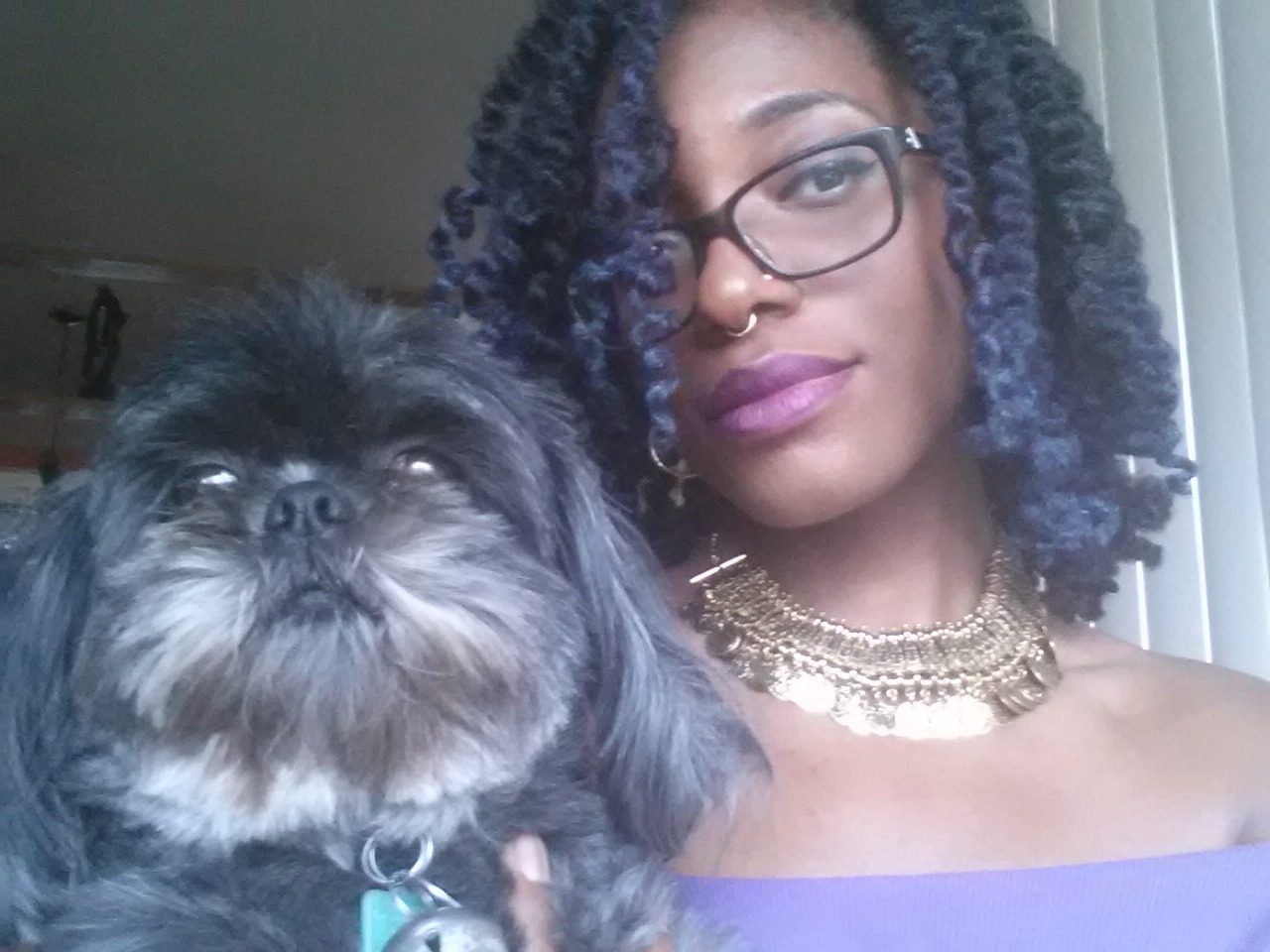 africanaquarian:  My dog hopped on the couch as I was taking my selfies so she obviously