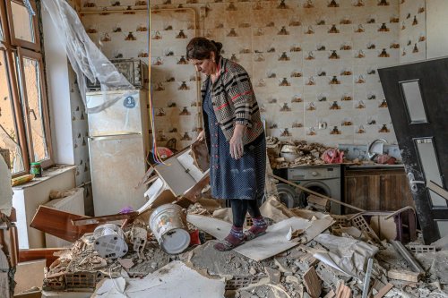 Xatire Celilova in her destroyed apartment following a ceasefire between Armenia and Azerbaijan, in 