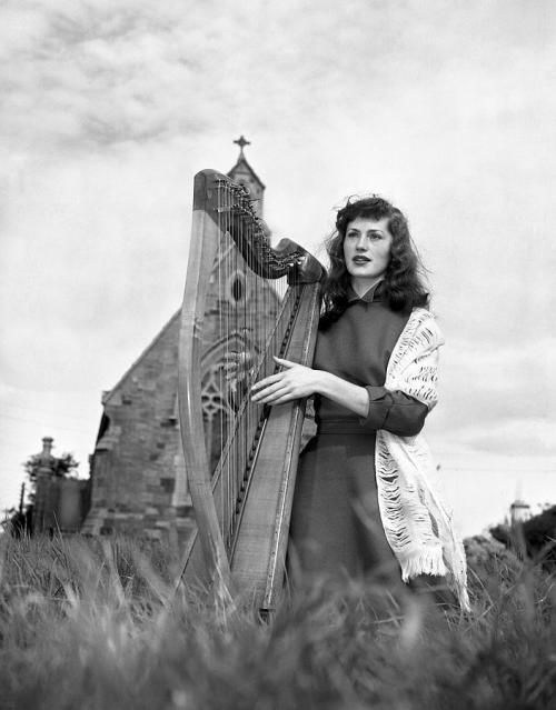 rustedshutter:“Irish singer and harpist, Mary O’Hara, pictured at Clontarf, Dublin.” | 1954