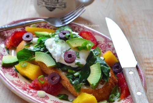 Poached Eggs on Spinach Avocado Cheese Toast with fresh fruit, olives and spring onions…This 