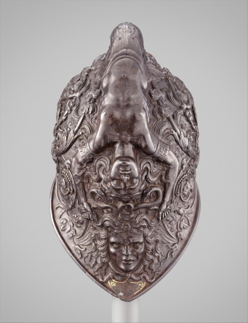 Burgonet: A mermaidlike siren forming the helmet’s comb holds a grimacing head of Medusa by th