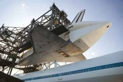 “Space shuttle Discovery is lowered onto