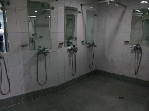 Two shower rooms for students at dormitory #1 (top) and #3 (bottom) of Woosong College in Daejeon, S