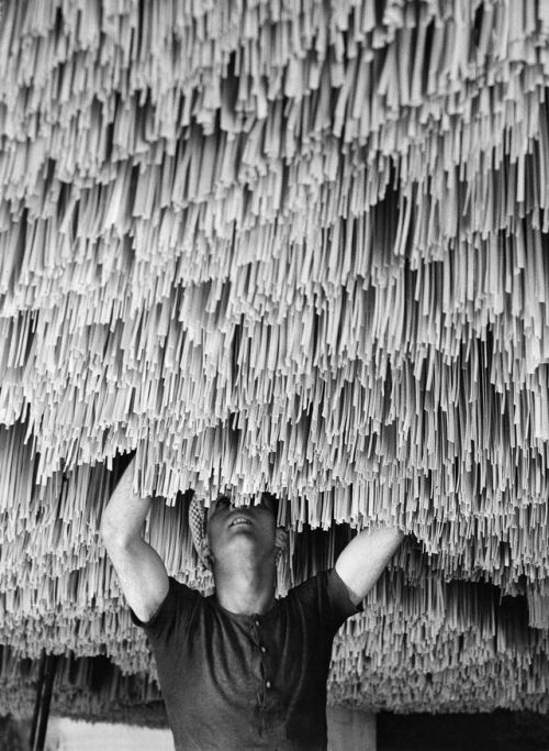 weirdvintage: A worker hangs pasta up to dry in a factory in Italy, photograph by Alfred Eisenstaedt