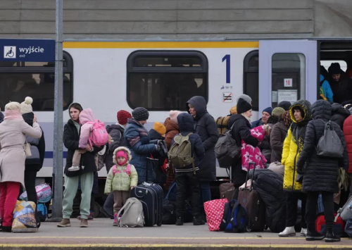 eowyntheavenger:Refugees arriving in Poland from Ukraine on Monday wait to board buses and trains to