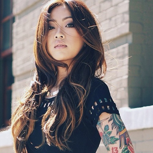 Beautiful lady with tatoo on arm