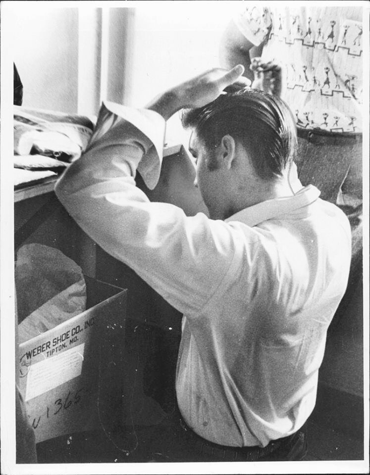 elvis-pink-cadillac:  Elvis Presley combing his hair before a show in 1956