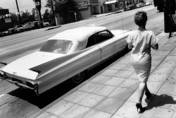 zzzze: Bruce Davidson  Woman Walking Along Wilshire Blvd, Los Angeles, 1964 Silver gelatin print