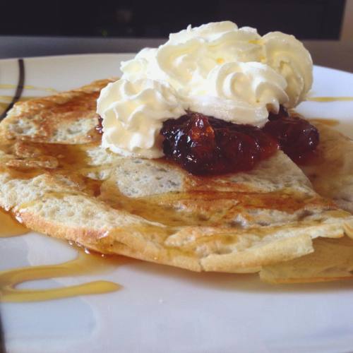 Nutella stuffed crêpes, topped with homemade strawberry preserve, Tabora honey and whip cream.