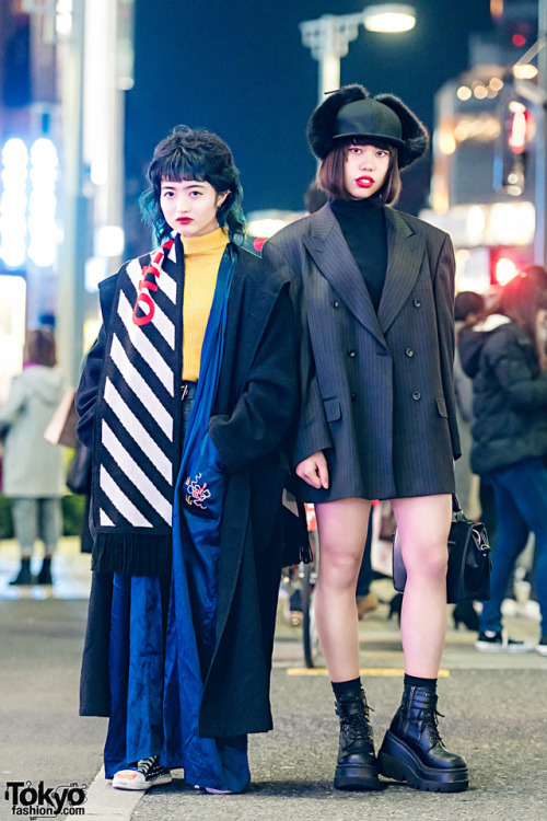 Japanese teens Rio and Sarah on the street in Harajuku at night wearing a mix of vintage and new fas