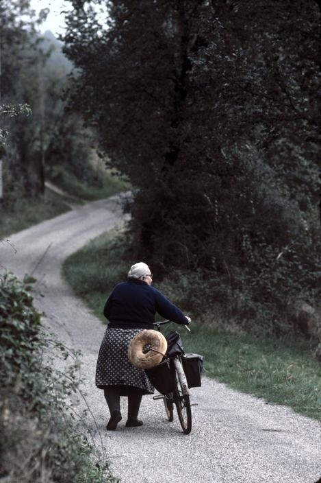 thecyclinglife:  ‘Woman with bicycle and bread - ‘Dordogne, 1977’, Jean Gaumy