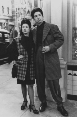 Look at them strutting down the street as if it were a fashion runway, someone roll out a red carpet for these two. I love the contrast between their firme style and the traditional clothes the man in the background is wearing. Their clothes were making