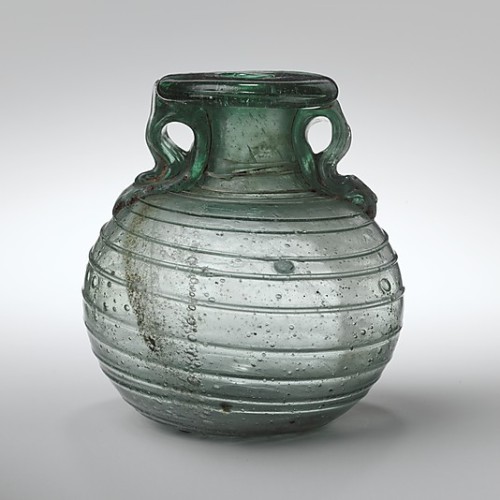 Glass aryballos (oil bottle), 6.7 cm high, Mid-Imperial Roman, 2nd–3rd century AD (Met Museum).  