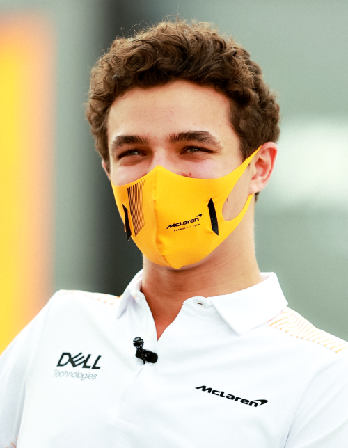 pitcrew:LANDO NORRIS ⟿ looks on in the Paddock during previews ahead of Formula 1 Testing at Bahrain