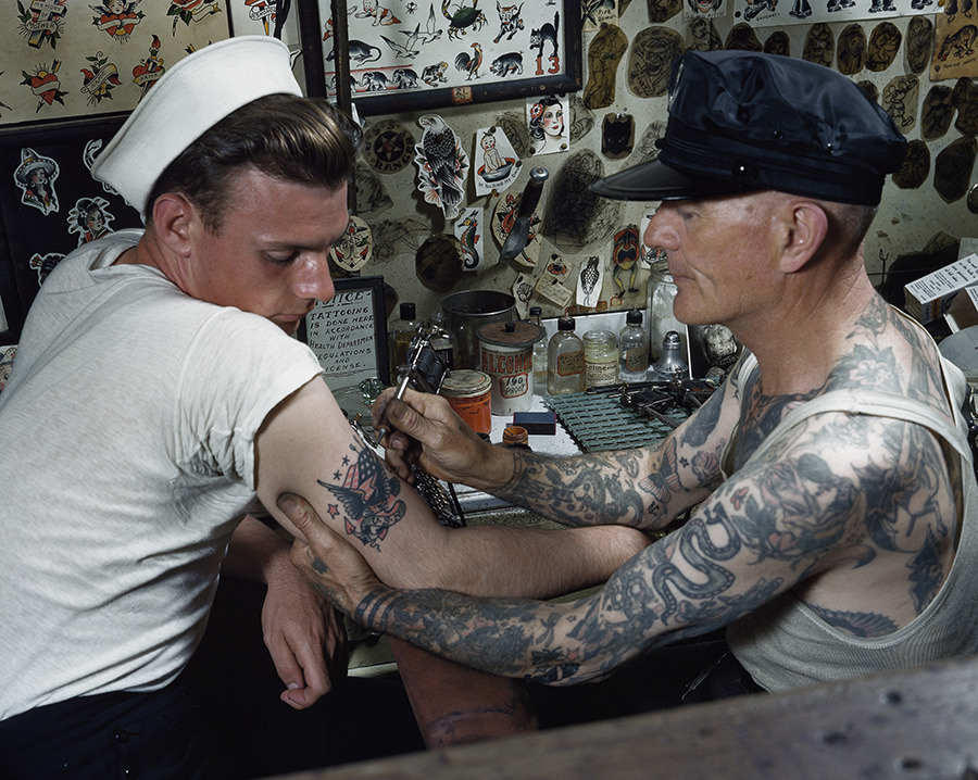 natgeofound:  A sailor gets a tattoo on his arm in Virginia.Photograph by Paul L.