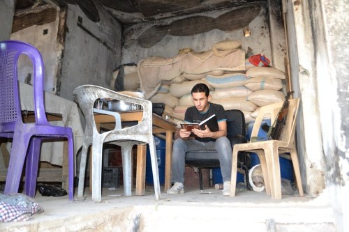 buzzfeedbooks:These Rebels Have Amassed A Library From Syria’s RuinsOutside, winter’s chill grips th