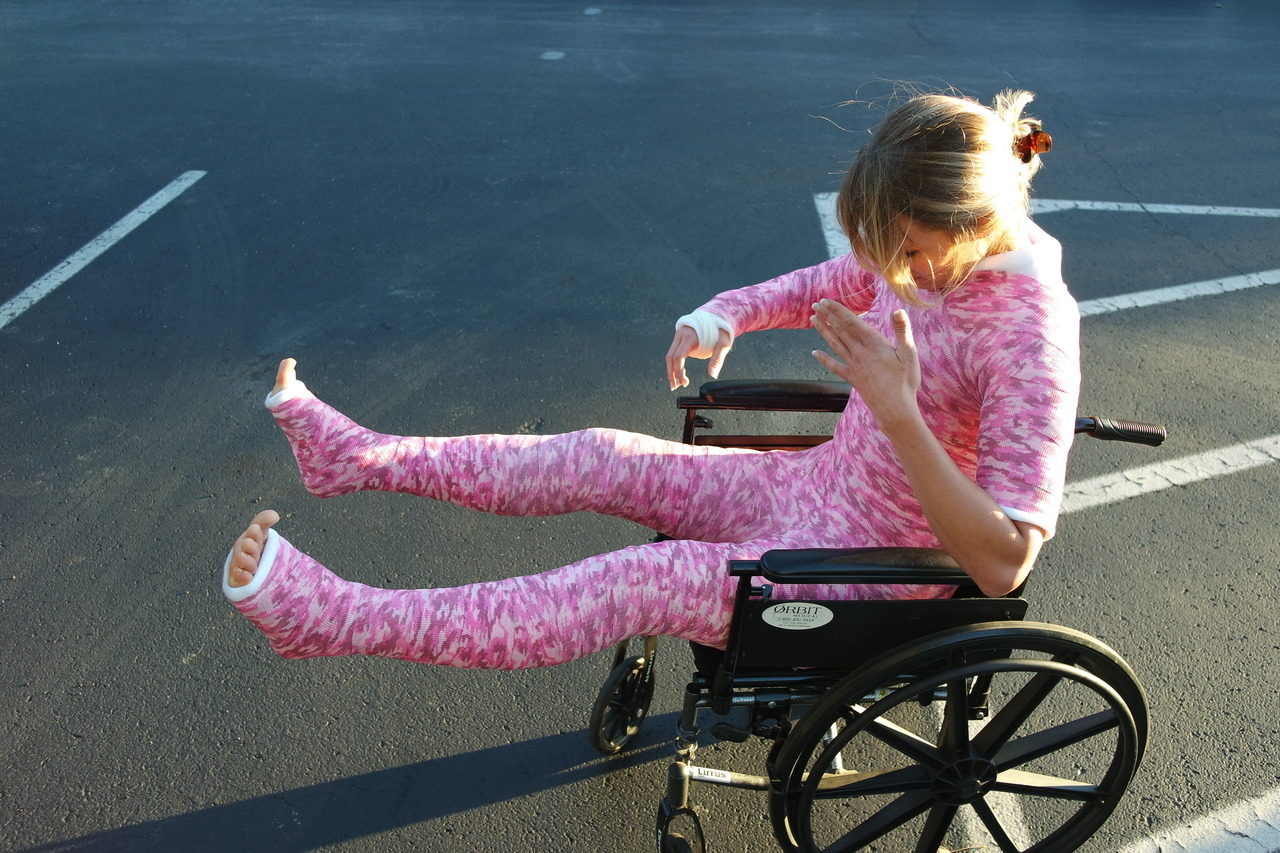 Blonde Girl in full body cast and wheelchair outdoor