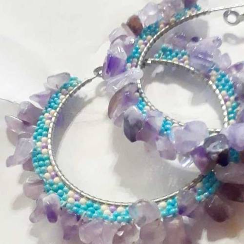 Turquoise, cream, and purple seeds edged with amethyst chips. Will ship anywhere. Price is $45 plus 