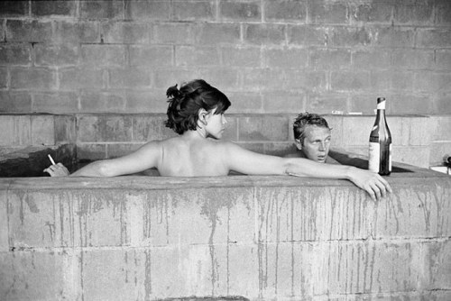 At Big Sur Steve McQueen and Neile Adams take a sulphur bath together, a bottle of wine propped near