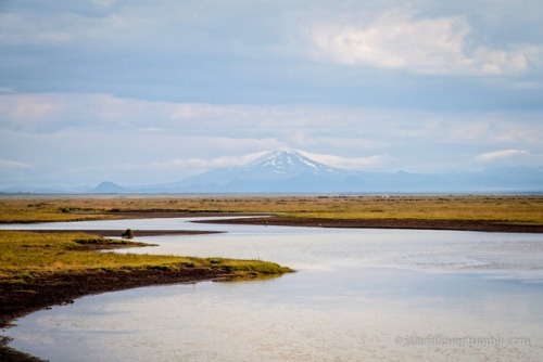 imiging: - Mountain in the distance Course of a river and a mountain at the horizon in the sout