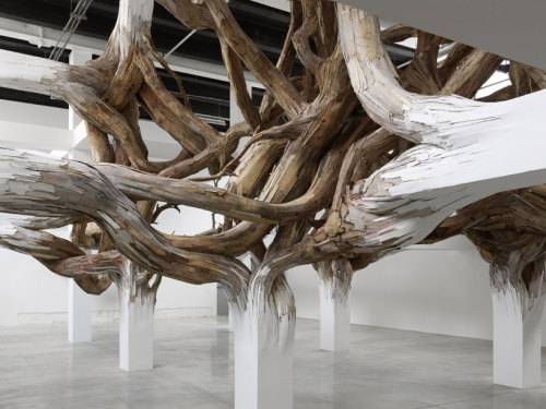 cjwho:  henrique oliveira | baitogogo at palais de tokyo, paris a complex network of organic material invades the architecture at the palais de tokyo in paris, in brazilian artist henrique oliveira’s ‘baitogogo’. the installation is a matrix of