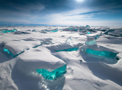 bobbycaputo:  The Gem-Like Turquoise Ice Found on Lake BaikalRussian photographer Alexey Trofimov calls Lake Baikal “the gem that does not need to be cut.” It’s the oldest, largest, deepest, and clearest freshwater lake in the world. Every winter,