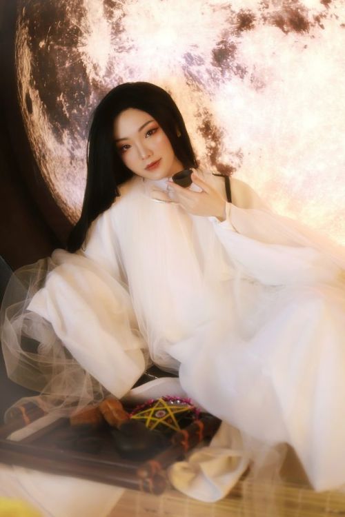 A Moon Festival-inspired white fantasy áo tấc, with elements of Hằng Nga, the moon goddess. T