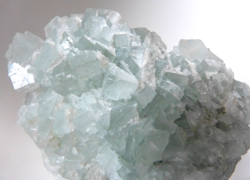 FLUORITE (Calcium Fluoride) from Madagascar. Pale green cubic fluorite crystals with drusy milky qua