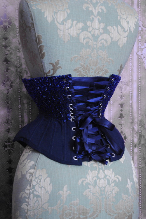 beneaththetower:  The Midnight Underbust, navy blue corset encrusted with hundreds of sequins, seed beads and bugles in shades of dark blue.  Inspired by the midnight sky.