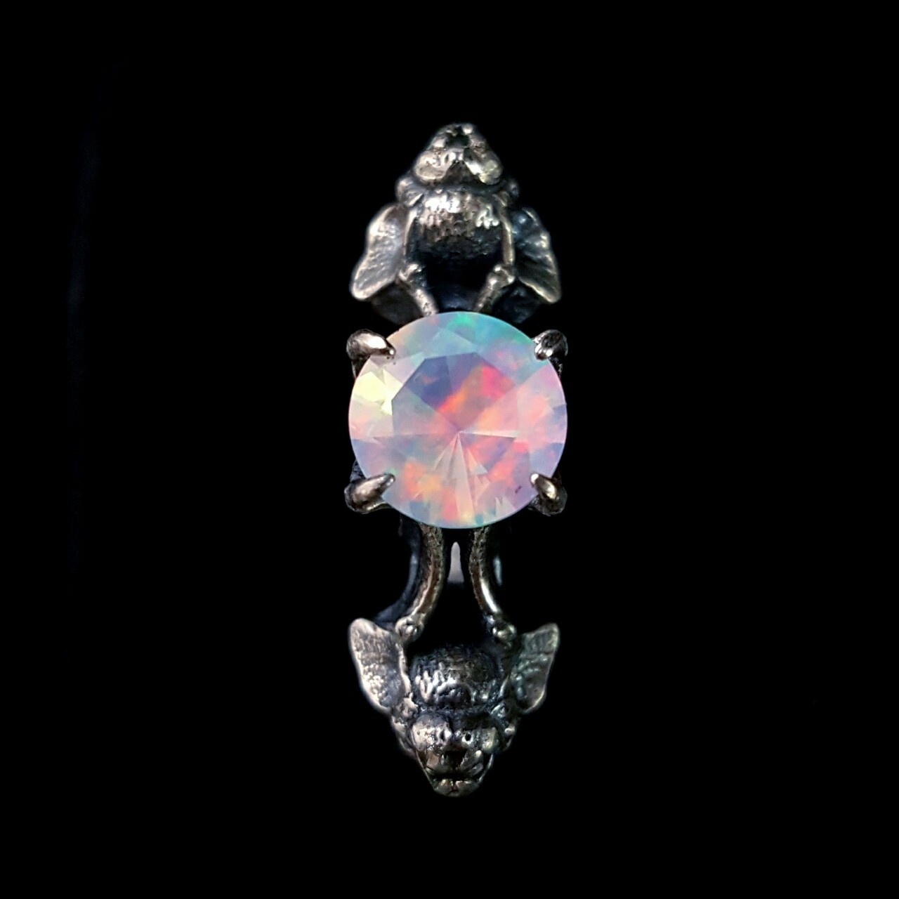 omniastudios:  Nocturne bat ring with a fiery Gilson opal.  www.omniastudios.com