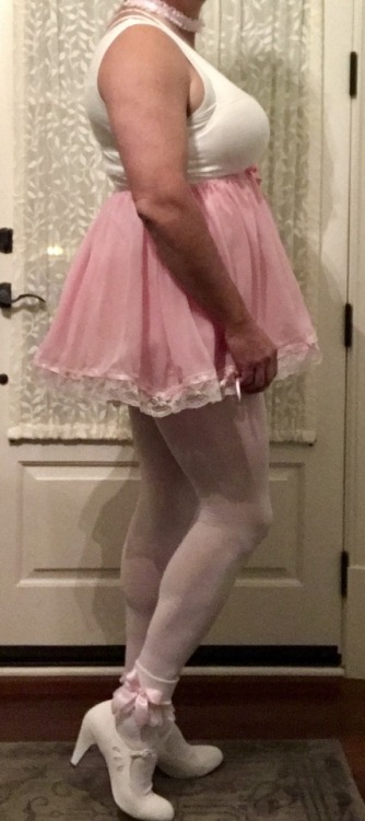 bulkydiaperboy:Do you like my new pink sissy skirt as much as I do. And my new heels.  Yummy. Sissy 