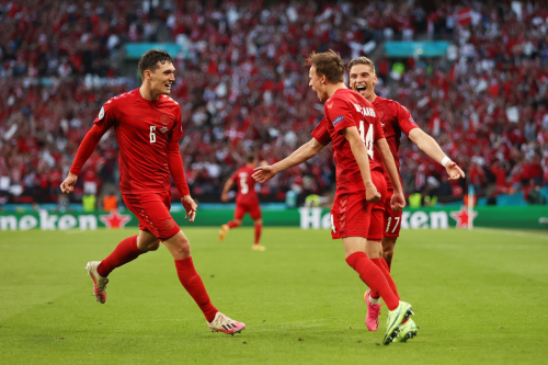 Mikkel Damsgaard celebrates his goal with teammates during the match vs. England