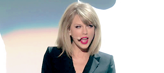 aroundsmyheart-deactivated20170: Taylor doing a cute hand gesture while singing Blank