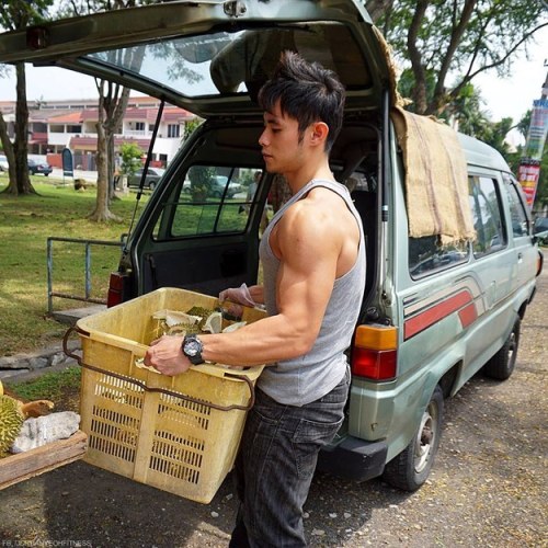 keepemgrowin:  buzzfeed:First, there was the Hot Bean Curd Vendor in Taiwan. Now there’s a Hot Durian Fruit Seller in Malaysia. This is a good trend. Forget the fruit… can I take this muscle hottie home?