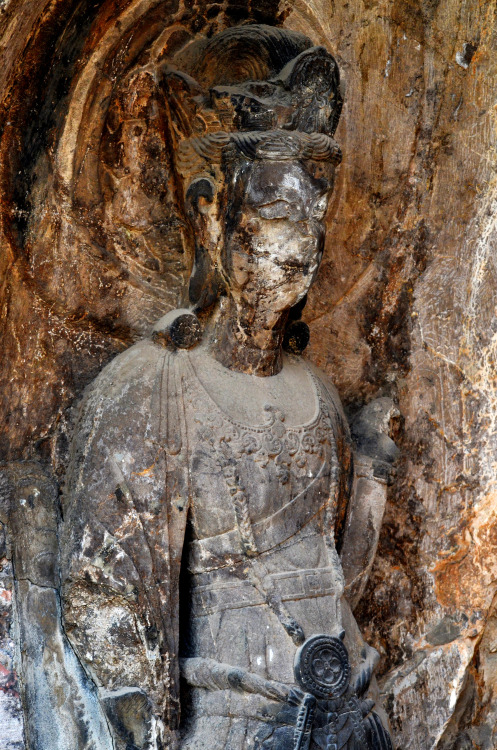 One of the estimated 100,000 stone statues at the Longmen Grottoes world heritage stie, Henan Proven