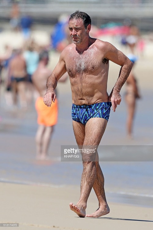 bizarrecelebnudes:  Andrew O’Keefe - Aussie Tv Presenter (Part 1) Love him. He always loves showing of in speedos by the beach. Love his hairy body. 