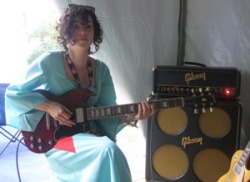 shellfishflavoredcandy:  Gibson News, Monday, August 22, 2005: Annie Clark of Polyphonic Spree tries out an SG Standard.