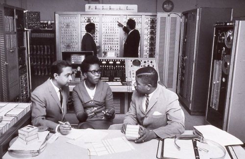 U.S. Census Bureau employees, circa 1960s, with the Film Optical Sensing Device for Input to Compute