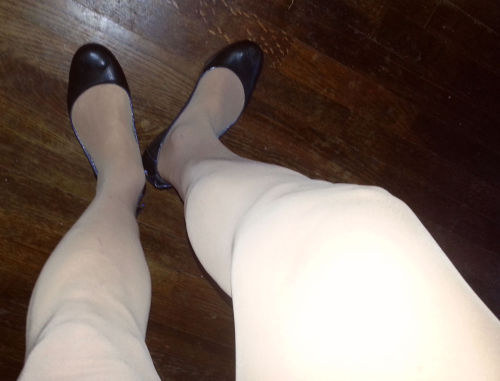 Navy Tommy Hilfiger flats and nude sheer-to-the-waist pantyhose. Left thumb in my mouth,