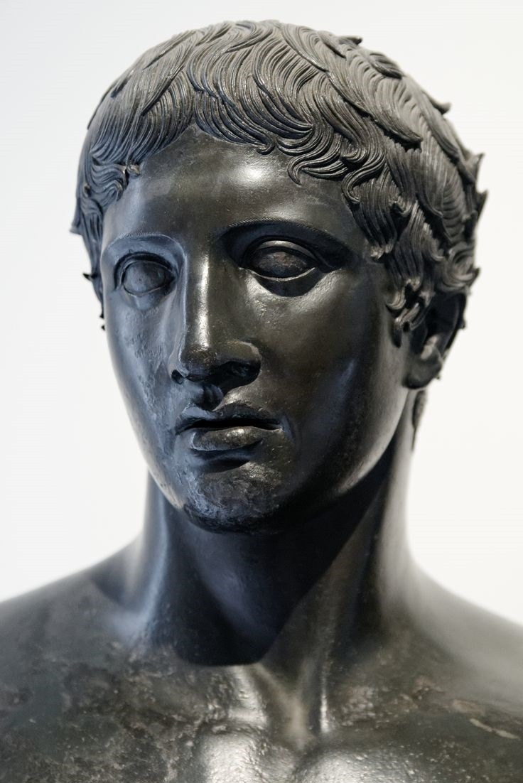 ganymedesrocks:  Herm in bronze with the head of the DoryphorosFrom the square peristyle