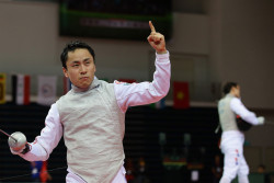 modernfencing:  [ID: a foilist holding up his index finger after winning a bout.] Yuki Ota, after winning men’s foil at the 2015 Asian Fencing Championships! 