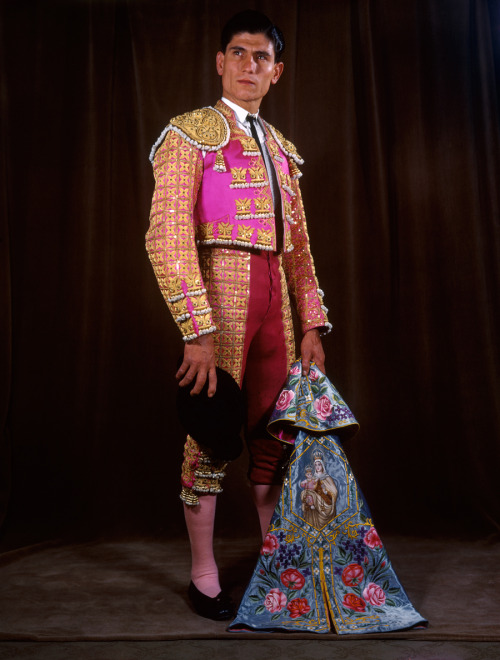 A matador poses in full regalia with an embroidered cape in Colombia, 1939.Photograph by Luis Marden