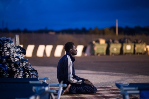 humanrightswatch: doctorswithoutborders: Photo by Ikram N’gadi A young man from Gambia prays i