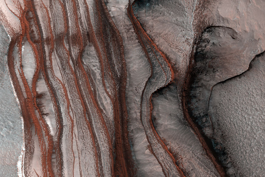 sagansense:   How did these layers of red cliffs form on Mars?  No one is sure. The