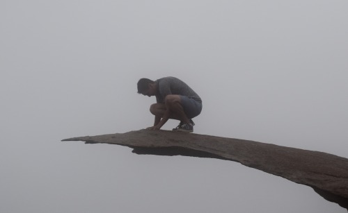 I hiked on Mt. Woodson in California to reach this rock called potato chip rock. It was very foggy a