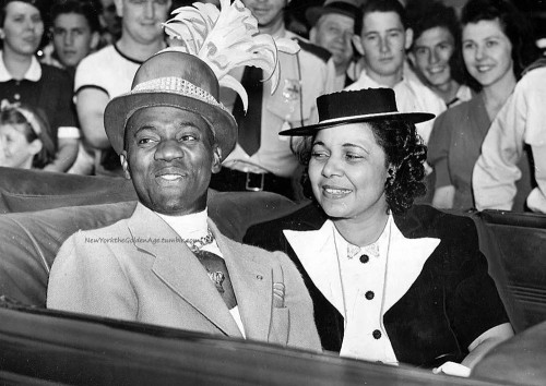 newyorkthegoldenage:  Mr. and Mrs. Bill “Bojangles” Robinson in an open-topped car among a crowd of fans on Bill Robinson Day at the World’s Fair, August 25, 1939. Photo: Afro American Newspapers/Gado/Getty Images