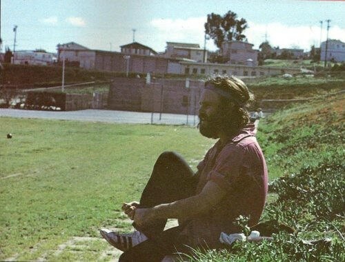 superseventies:  Jim Morrison sitting on hill in Redondo Beach (South Bay) putting on Adidas shoes.  Photo by Frank Lisciandro, 1971. 