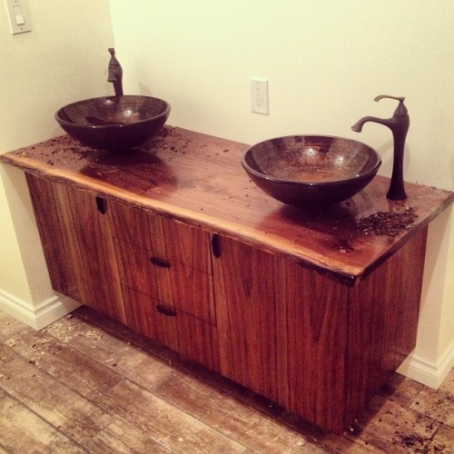 Just installed a bathroom vanity with live edge walnut counter, hand made veneer, ebony pulls vessel