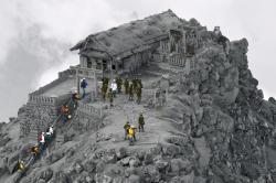 sixpenceee:  Unedited picture of rescuers at a shrine near the summit of Mt. Ontake, the volcano which erupted last week, killing at least 51 with 13 still buried under rocks and ash. (Article)