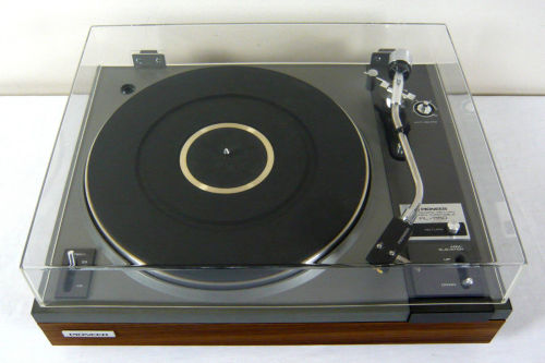 Pioneer PL-115 | Auto Return Belt DriveTurntable. Reconditioned and serviced. Semi automatic. Original vinyl removed and replaced with real wood walnut veneer. Mechanism cleaned and lubricated. The dust cover has been buffed and polished. Sure Hi Track